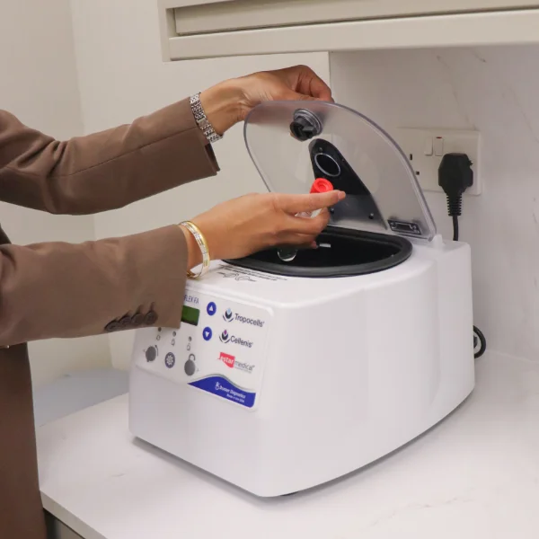 Why PRP at Surgicare is Different Practitioner placing extracted blood into a centrifuge